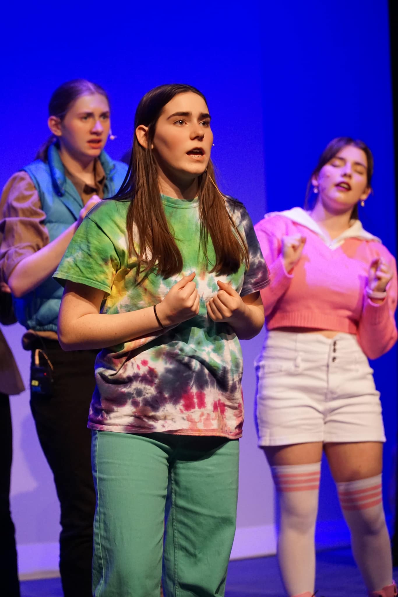 Three performers onstage as part of the Juvenis Festival